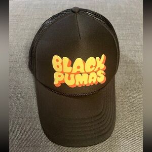 Black pumas trucker hat